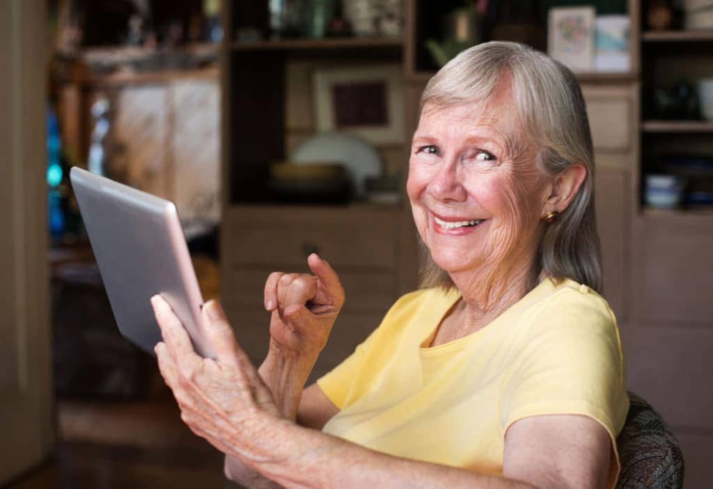 over 55 women using a tablet device