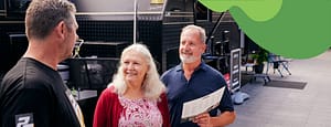 Two elderly people talking to a caravan salesperson at the Sydney Caravan Camping Lifestyle Expo