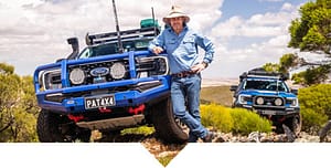 Pat Callinan leaning against his blue four wheel drive