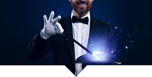 Magician in a tuxedo holding a wand with magic coming from a top hat