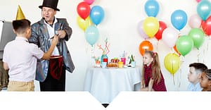 A kids' magician performing a show in front of kids.