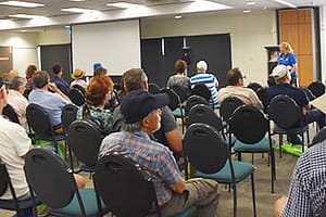 Room full of people listing to the Daily Seminar at the Supershow