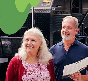 Two elderly people talking to a caravan salesperson at the Sydney Caravan Camping Lifestyle Expo