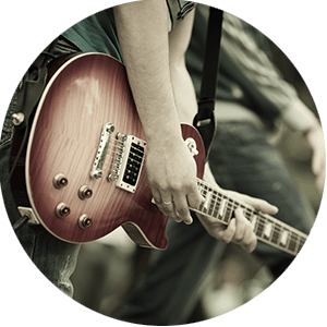 Person playing an electric guitar.