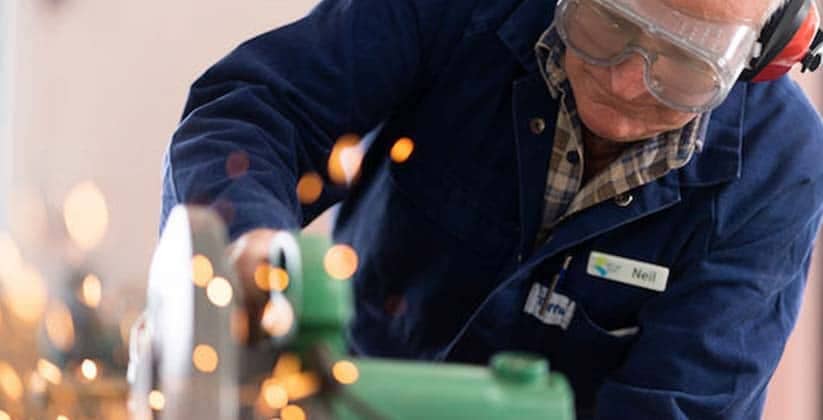 Senior man using hand tools