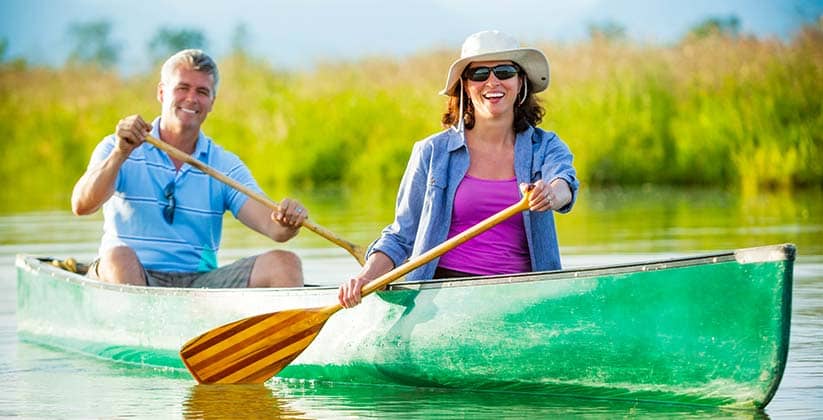 Elderly couple enjoying time in a canoe